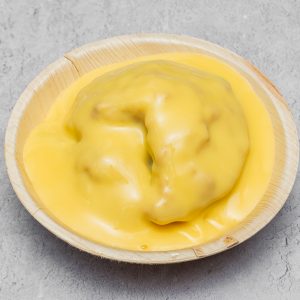 Warm apple crumble served with creamy vanilla custard.
